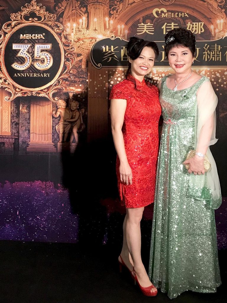 Anna Burns with a colleague in formal dresses at the MEICHA 35th Anniversary celebration