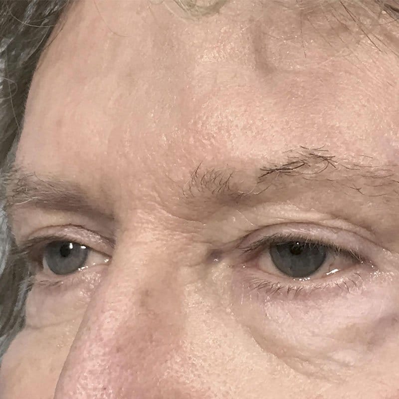 Close-up of a men's eyebrow tattoo result
