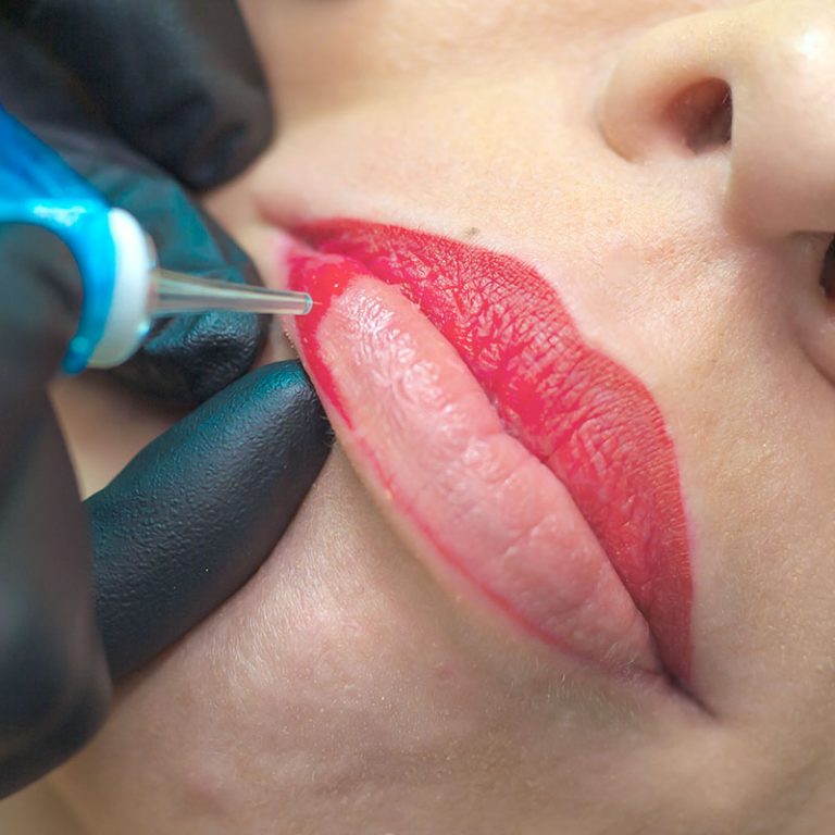 Lip blush permanent makeup procedure on a client's lips